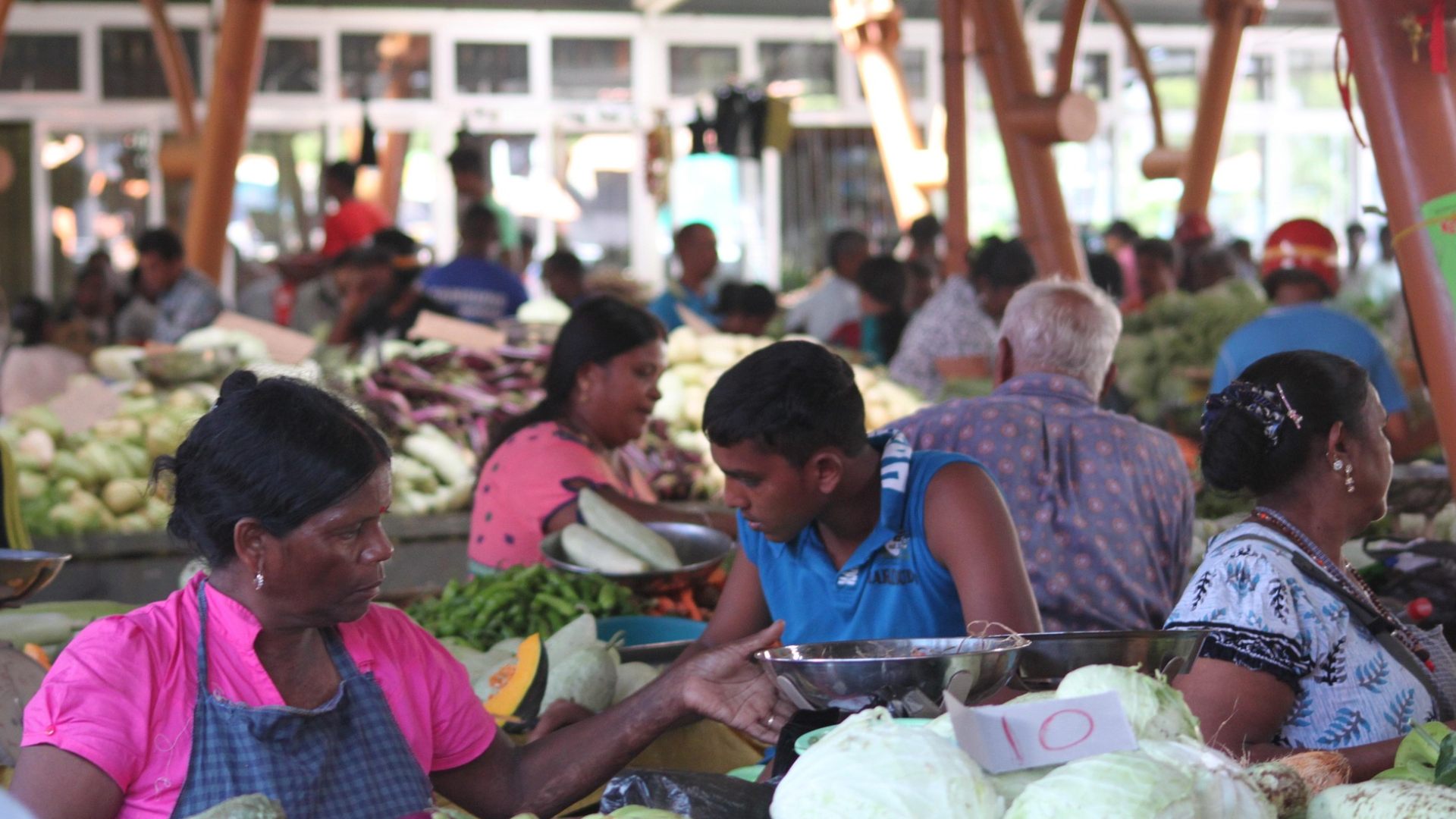 Authentic Mauritian market scene with vibrant stalls and local vendors