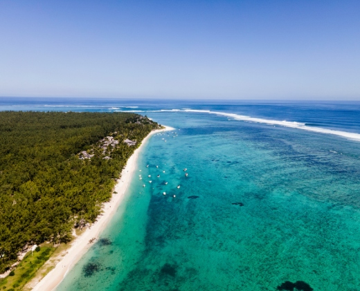 Kitesurfer riding in the turquoise lagoon of Le Morne, Mauritius