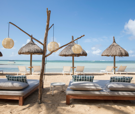 South Beaches, Mauritius, featuring beach loungers, crystalline water.