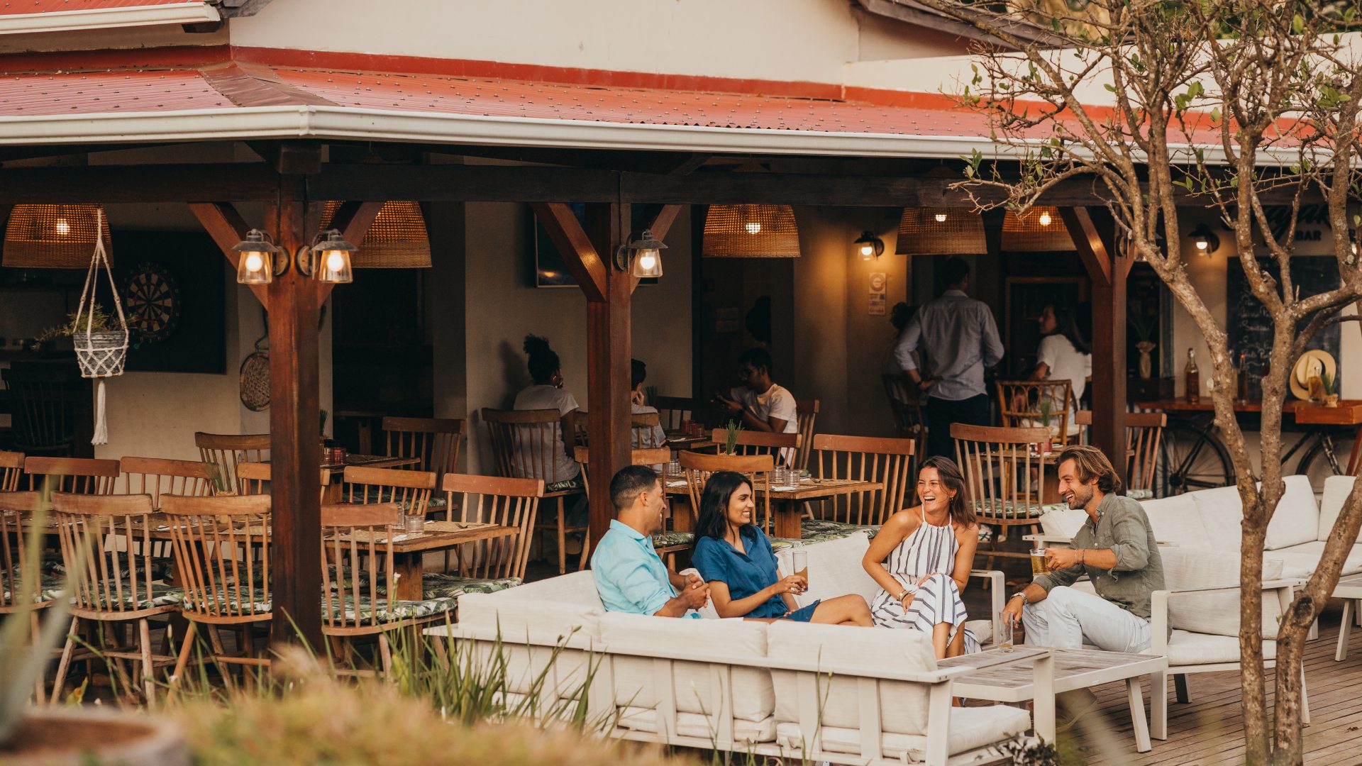 Family and teenagers gathering together for dinner at Kaz'alala, Bel Ombre, south Mauritius