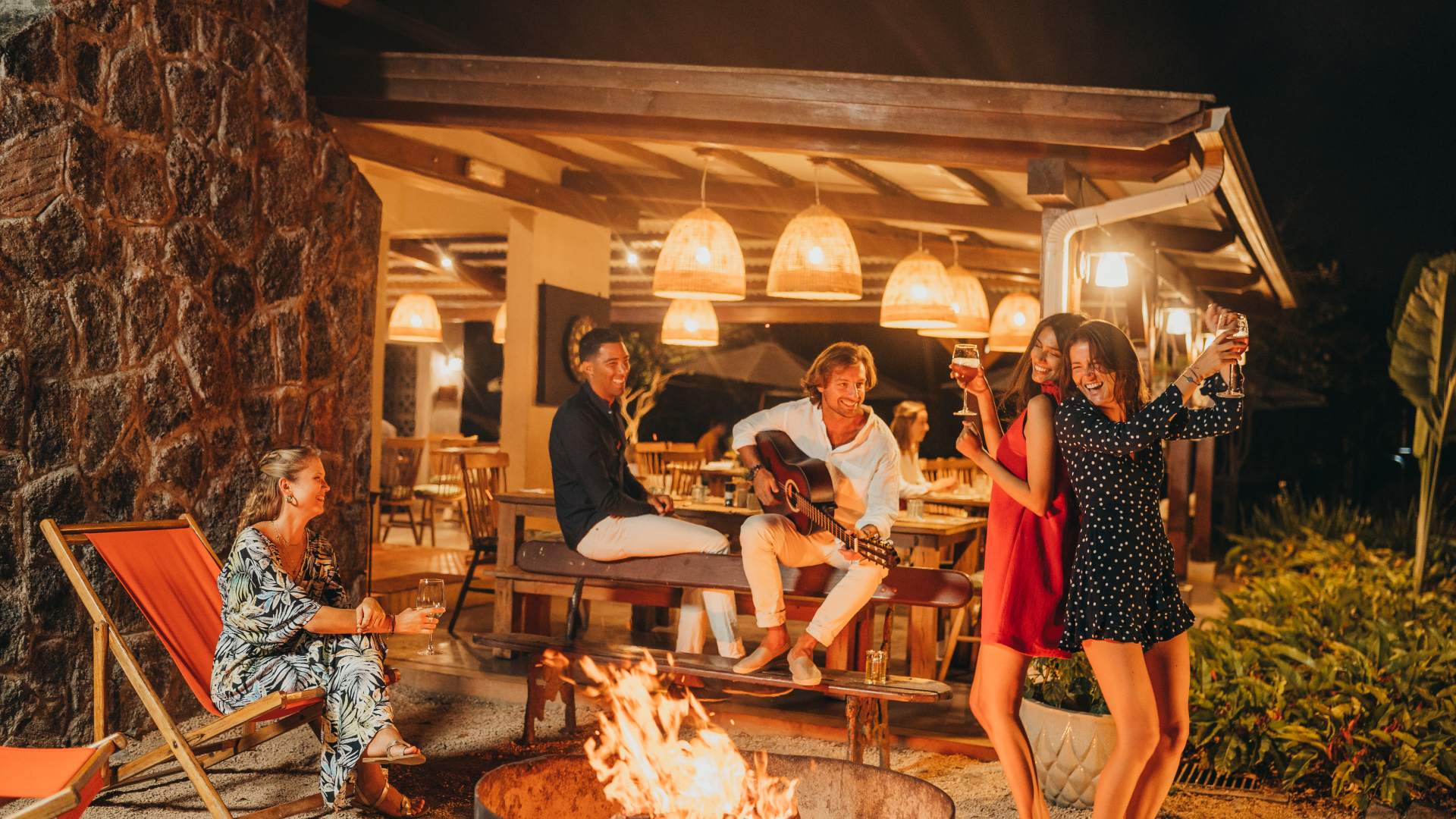 A group of colleagues dancing and enjoying themselves during a team retreat in Mauritius
