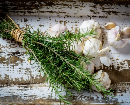 Fresh garlic and rosemary used as aromatic ingredients in Mauritian cuisine